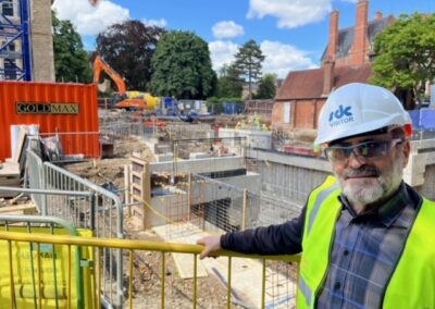 A man standing in front of the Norham St Edmund construction works