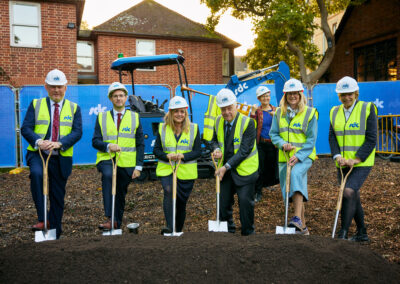 A group of people with spades at a groundbreaking ceremony