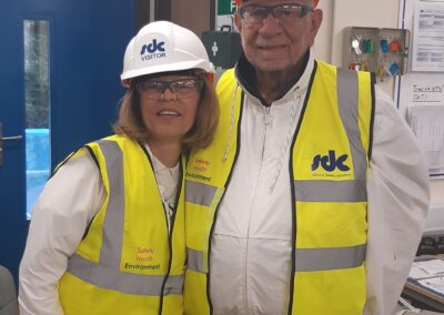 Two people standing at the Norham St Edmund construction site