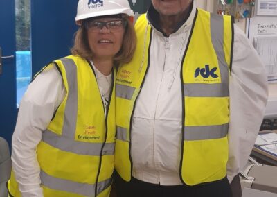 Two people standing at the Norham St Edmund construction site