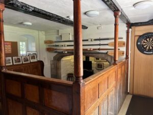 The Well Bar, complete with rowing oars, dartboard, and images of sporting success!