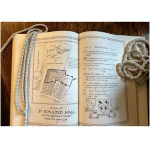 A picture of a book with a floorplan image of the Hall in about 1470 (with Black Hall, Chimney Hall, and White Hall behind)