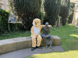 A Teddy Bear mascot sat next to the statue of St Edmund by St Peter in the East church/library